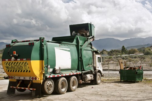 Waste clearance service truck in action in Hoxton